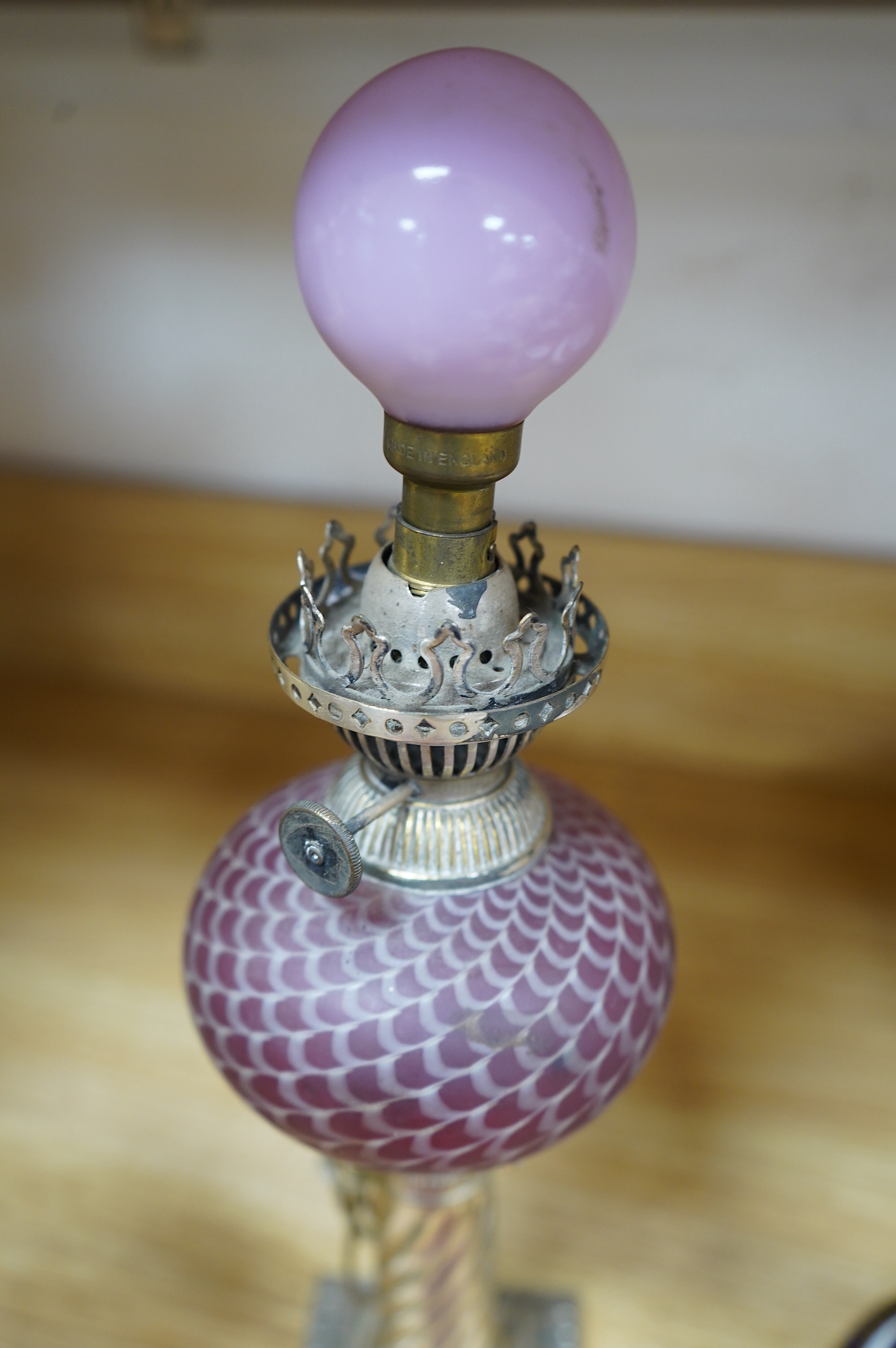 A pair of electroplate and ruby glass oil lamps, 35cm. Condition - good, not tested as working